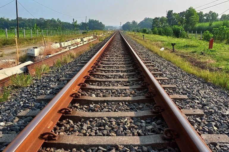 A railway track or railroad track, is the structure on a railway or railroad consisting of the rails. It enables trains to move by providing a dependable surface for their wheels to roll upon.; Shutterstock ID 2474301695; purchase_order: aljazeera ; job: ; client: ; other: