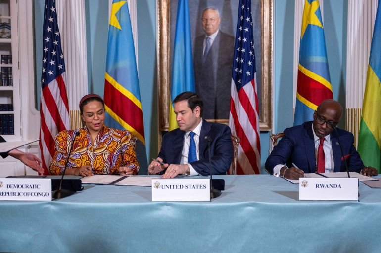 US Secretary of State Marco Rubio (C), Rwandan Foreign Minister Olivier Nduhungirehe (R) and Democratic Republic of the Congo Foreign Minister Therese Kayikwamba Wagner sign a Declaration of Principles between the two countries in the Treaty Room of the State Department in Washington, DC, on April 25, 2025.