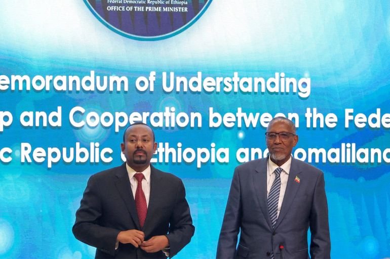Somaliland President Muse Bihi Abdi and Ethiopia's Prime Minister Abiy Ahmed attend the signing of the Memorandum of Understanding agreement, that allows Ethiopia to use a Somaliland port, in Addis Ababa, Ethiopia, January 1, 2024. REUTERS/Tiksa Negeri